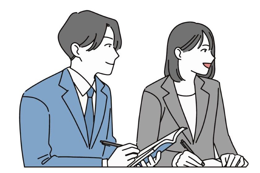 研修を受けるスーツ姿の男性と女性